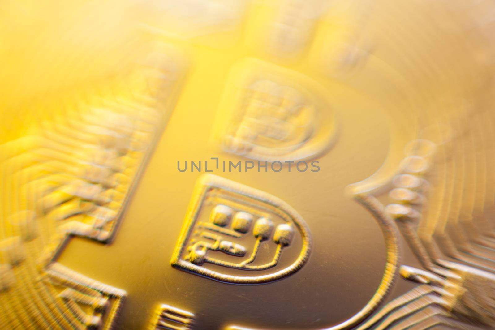 Gold light of Bitcoin currency coin extreme close-up by adamr