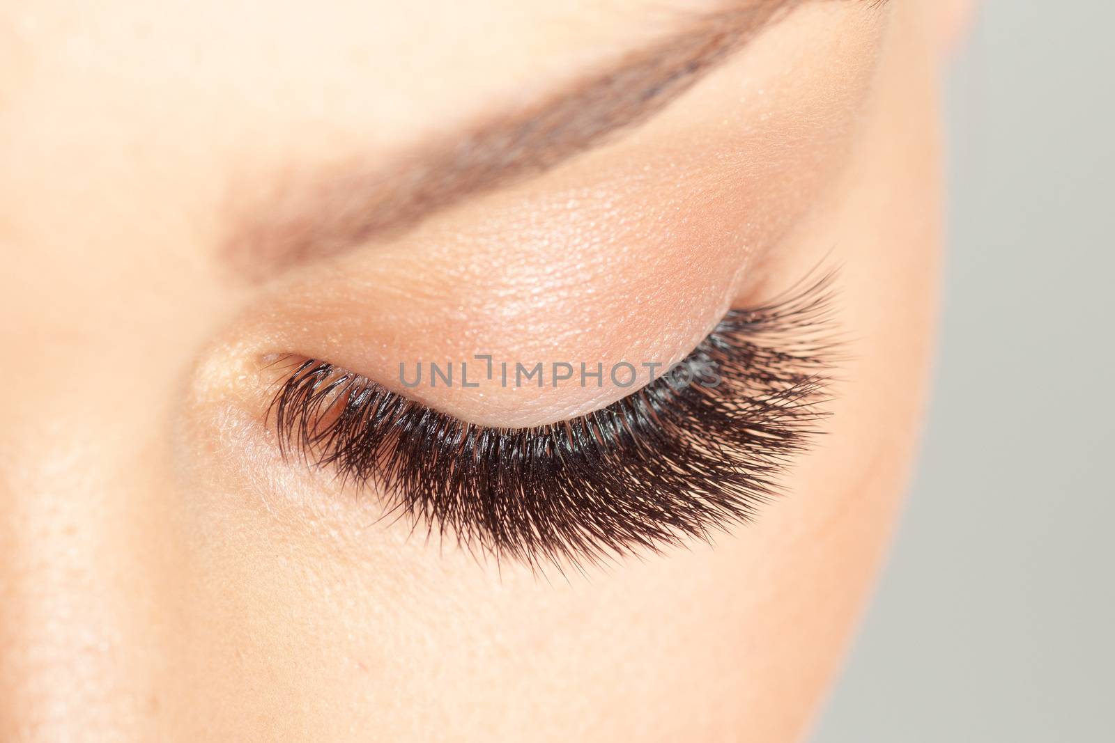 Close up shot of closed eye with long eyelashes. Eyelash Extensi by adamr