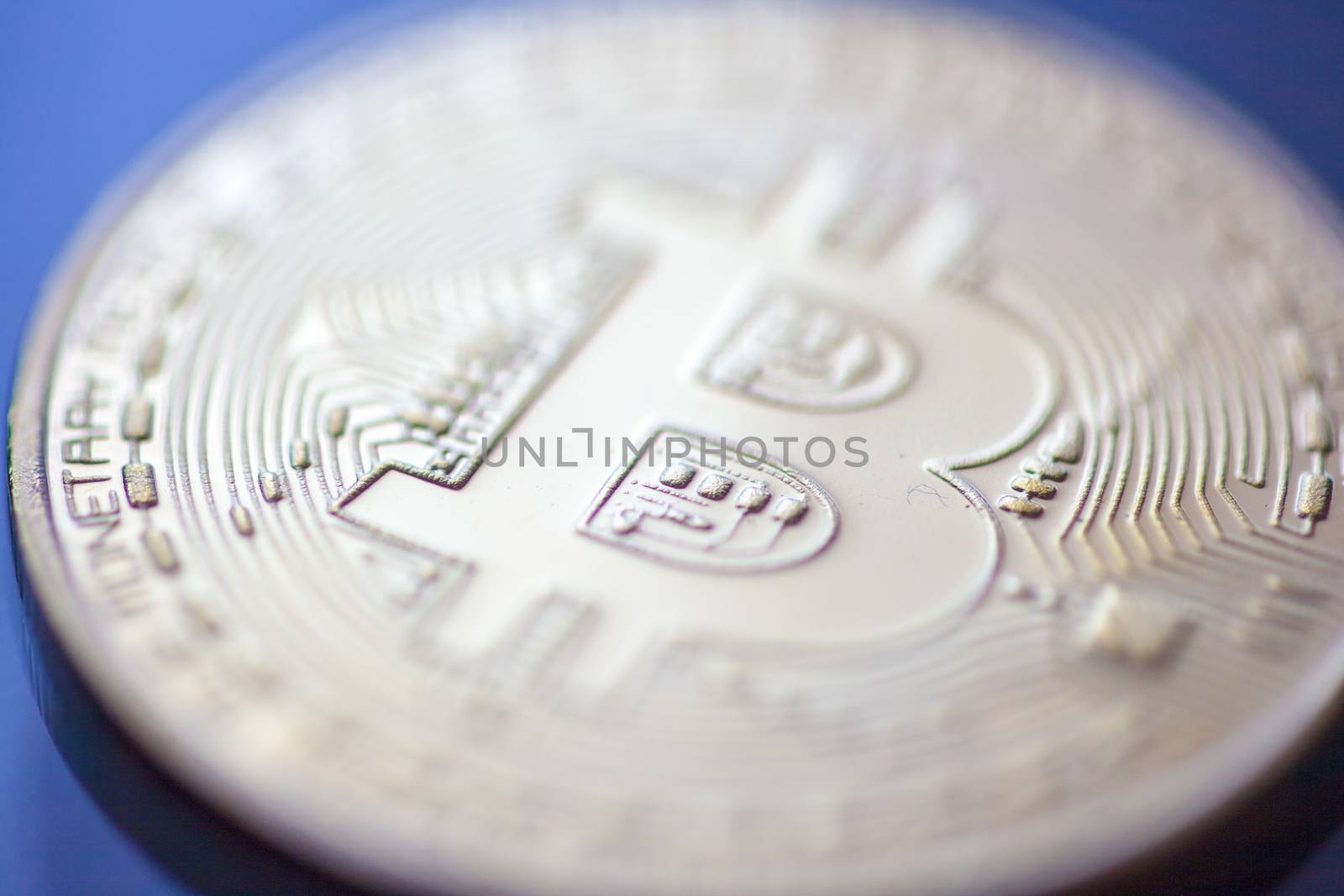 Bitcoin currency coin extreme closeup macro. Gold metal symbol