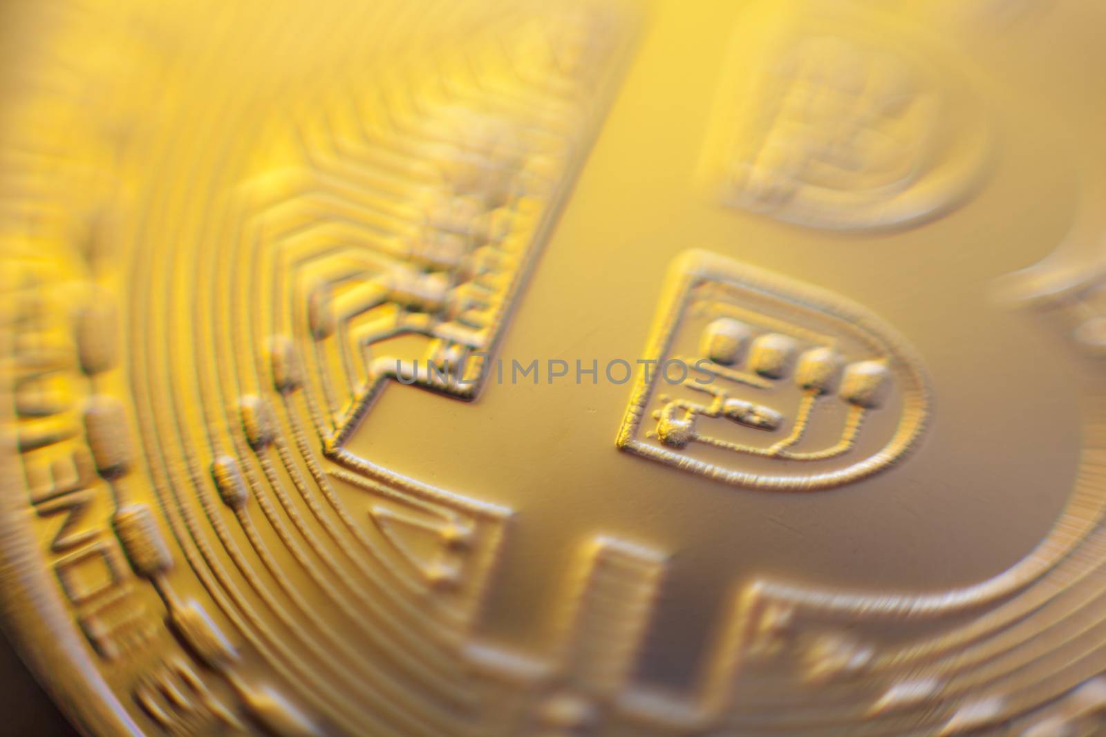 Bitcoin currency coin extreme closeup macro. Playing with color lights