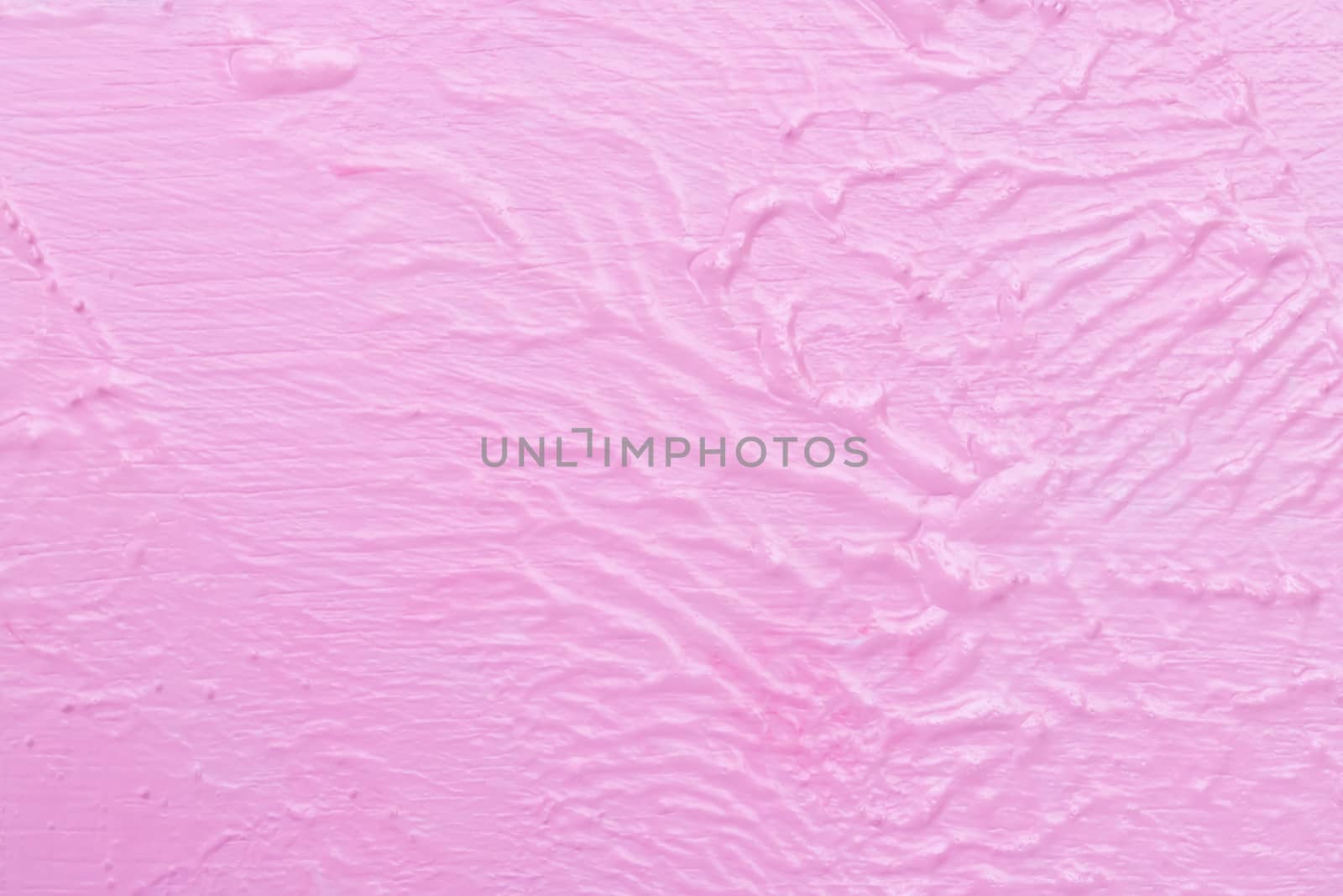 The texture of the rugged pink wall and structure background. Blurred uneven wall paint of watercolor on a wooden floor.