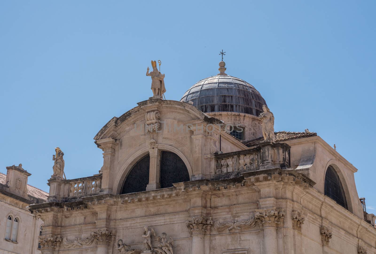 Statues and dome on St Blaise church in the old town of Dubrovnik in Croatia