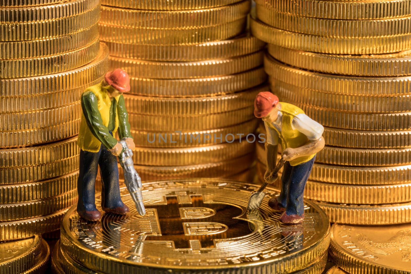 Concept illustration of two miners mining new bit-coin cybercurrency virtual coins in the blockchain
