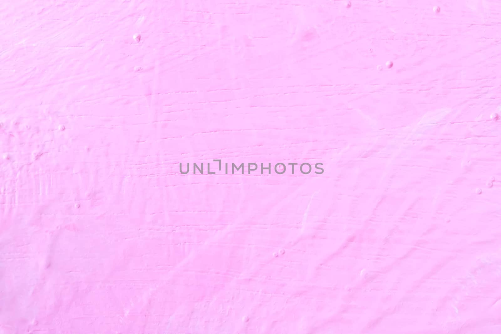 The texture of the rugged pink wall and structure background. Uneven wall paint.