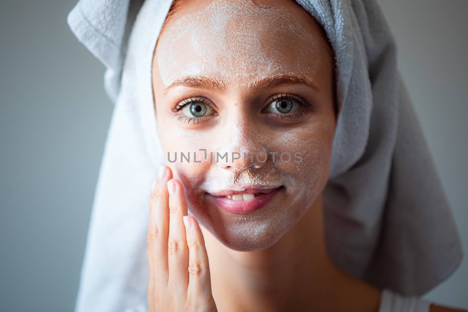 Cute girl washing cleaning face and skin with soap and wather