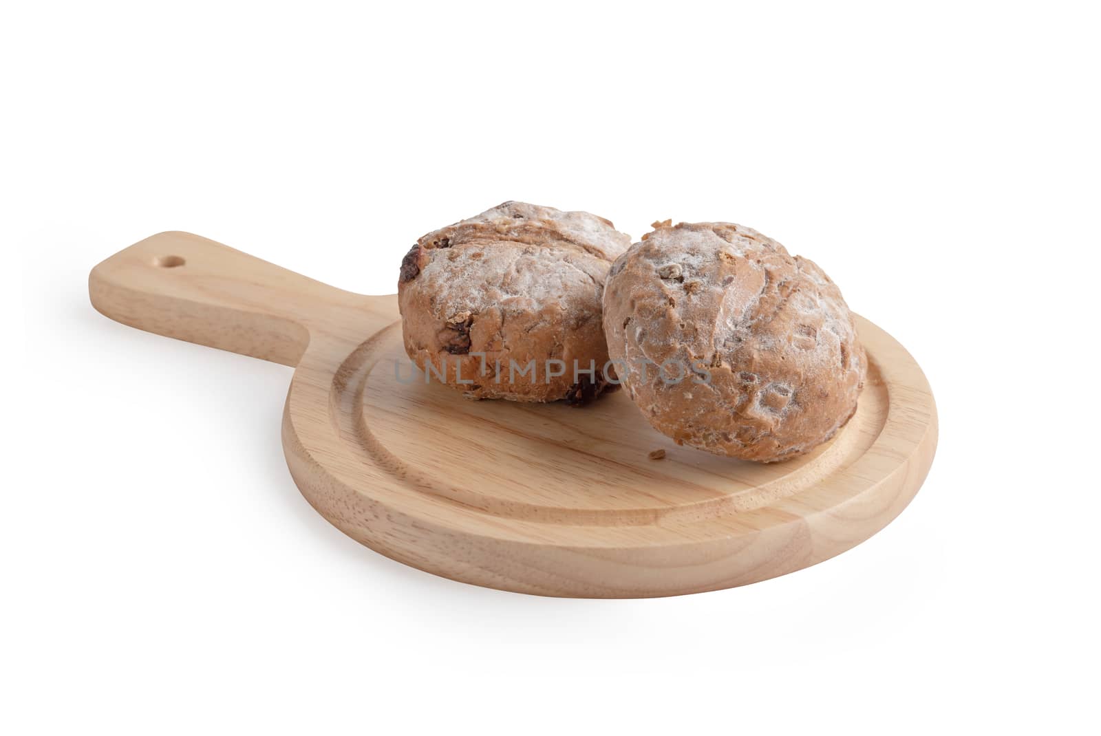 Homemade buns on the cutting board isolated on the white background with clipping paths. Bread is a food made from wheat flour mixed with water and yeast or baking powder. Other ingredients are also used to enhance the color, flavor and aroma. Varies according to each type of bread.