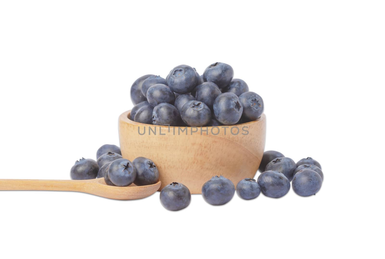 Blueberries in wooden bowl isolated on white background