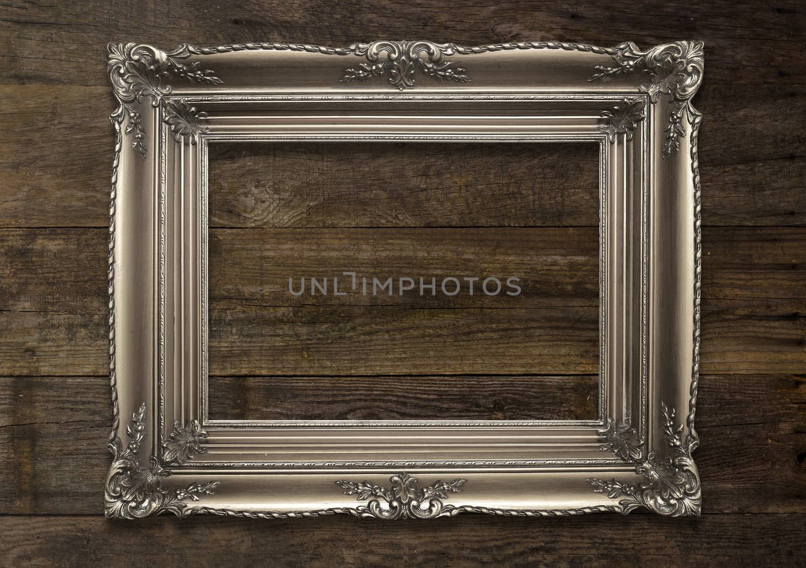 Old Brown Picture Frame on wooden background by adamr