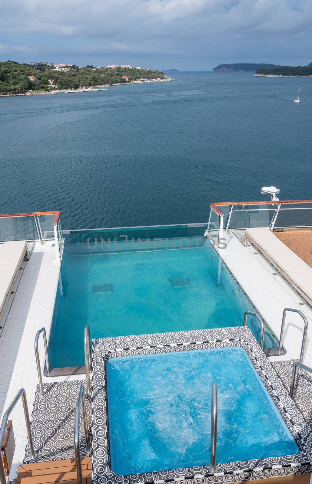 Infinity swimming pool on ship in the port of Dubrovnik in Croatia by steheap