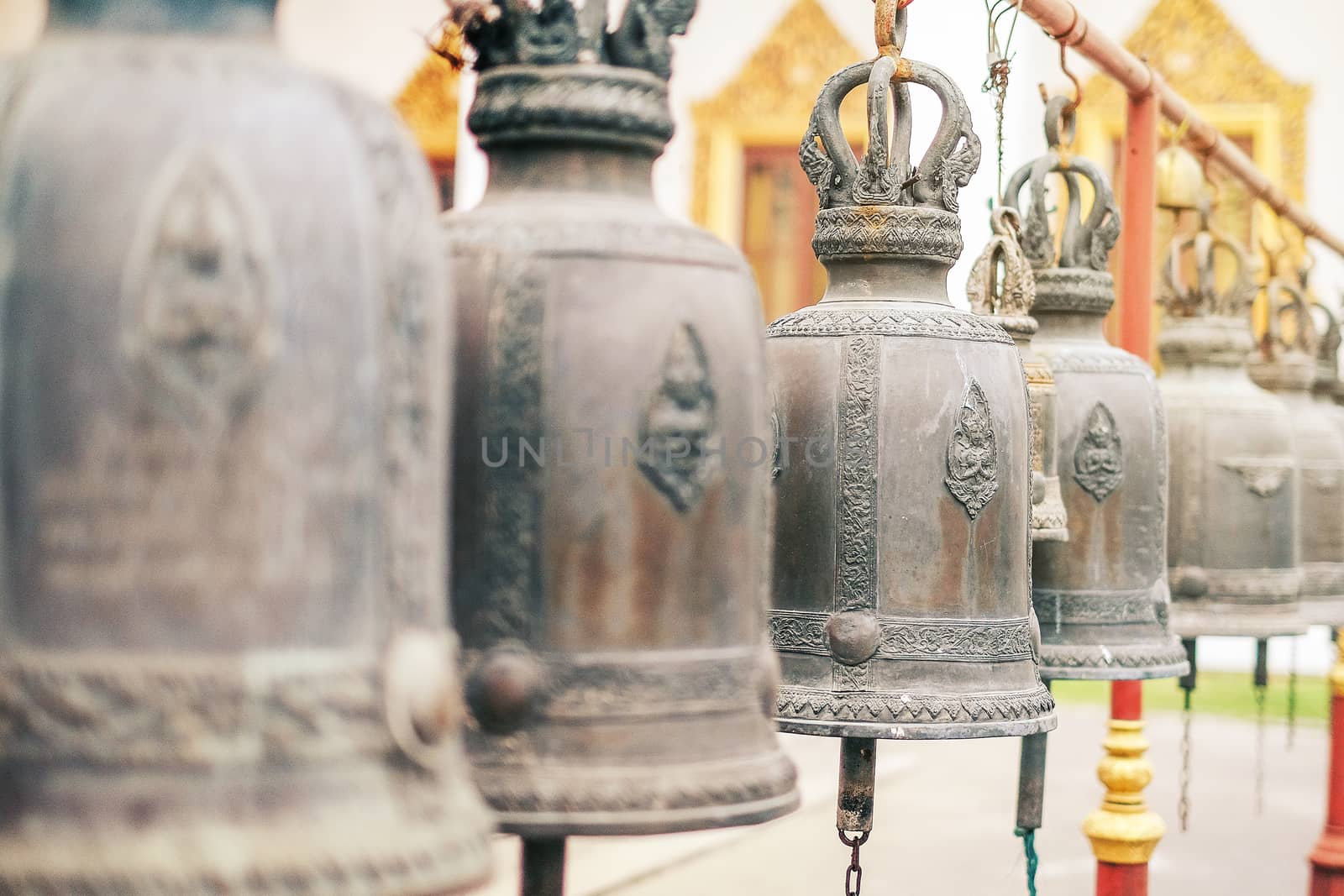 Big brass bell in Thailand temple by Surasak