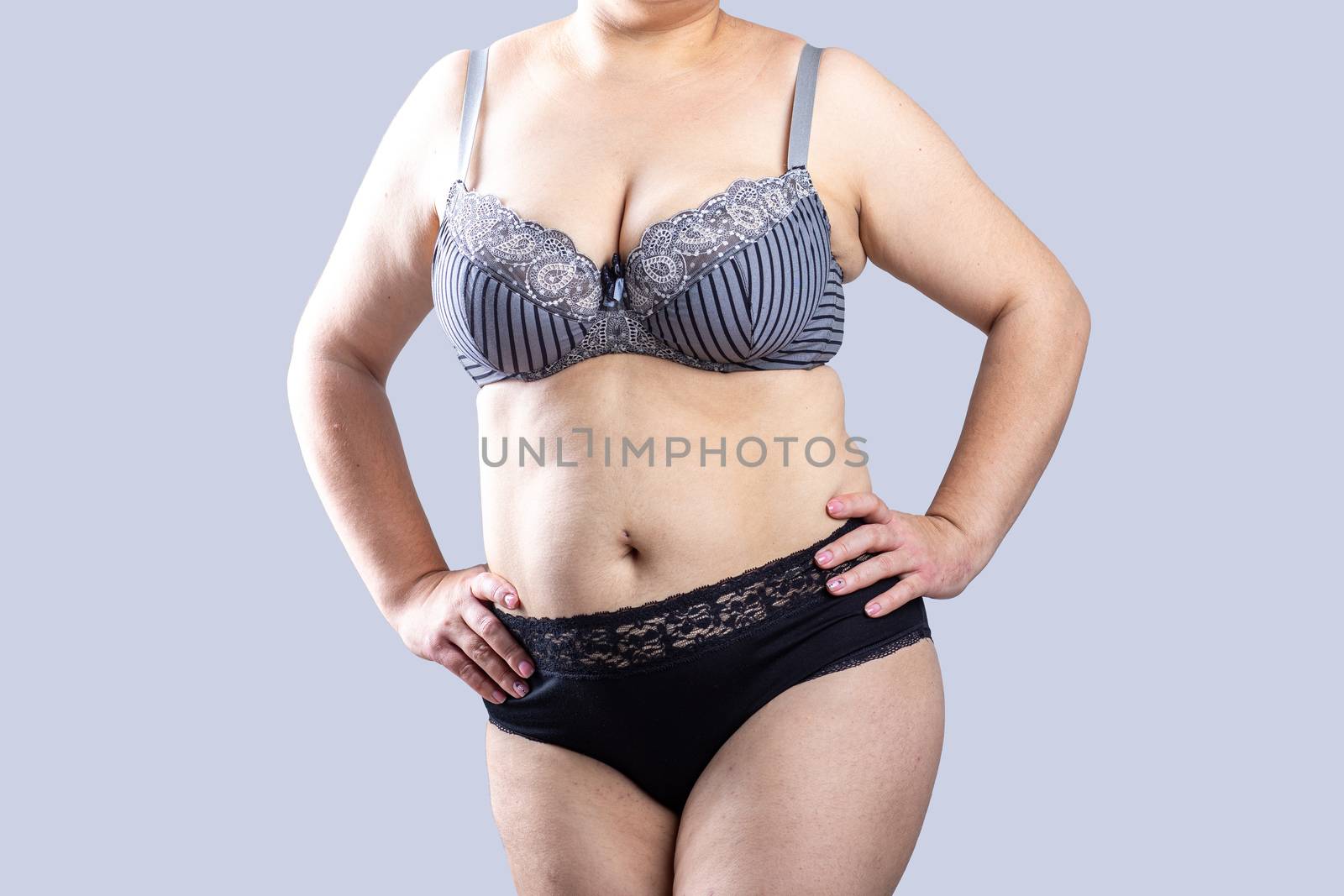 Woman Real Body Plus size Model in lingerie posign, imperfect nonideal