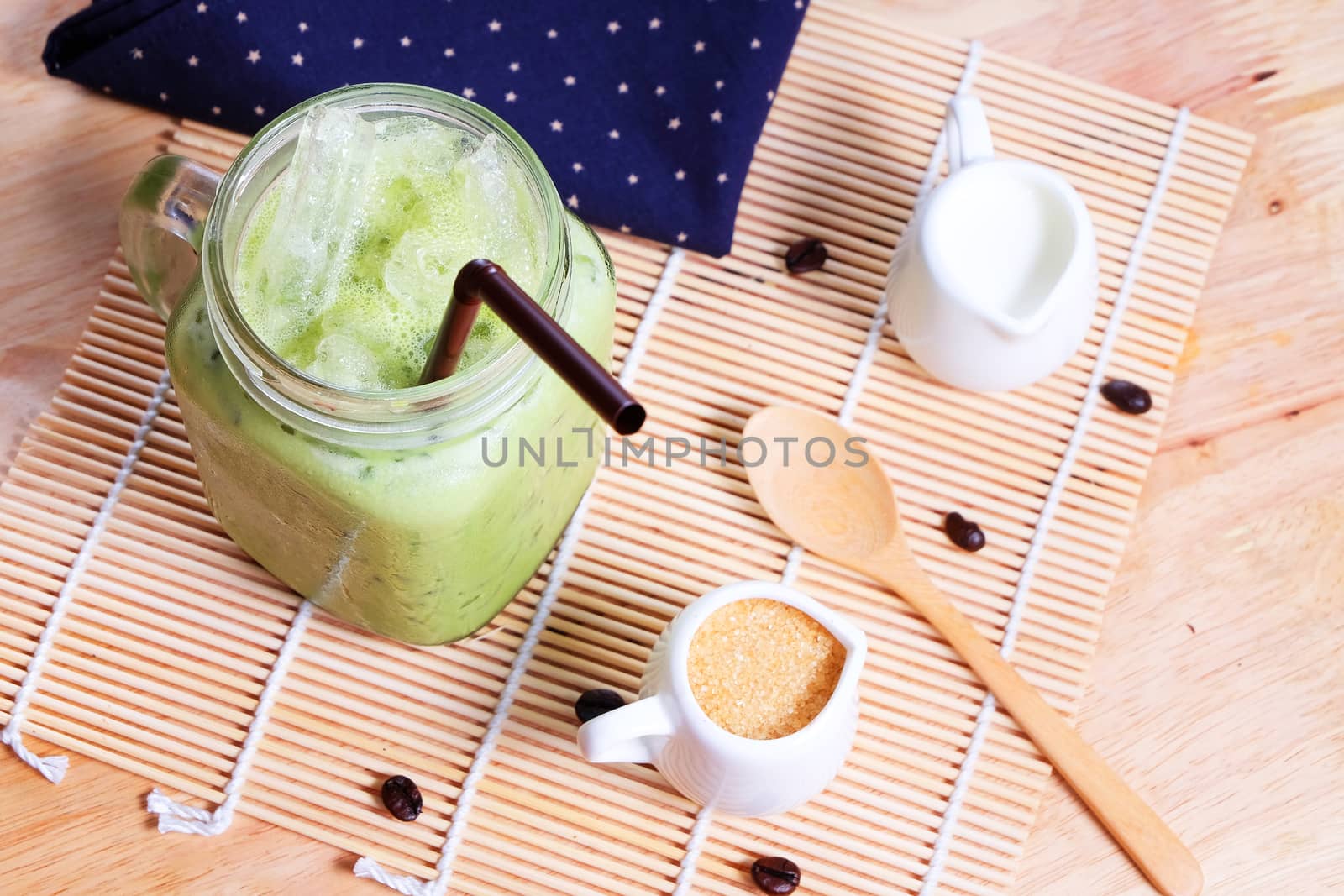 Green tea coffee on wooden texture table by Surasak