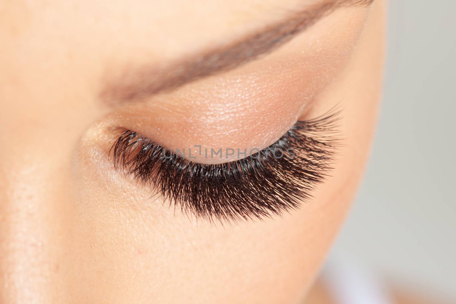 Treatment of Eyelash Extension. Lashes. Woman Eyes with Long Eyelashes.