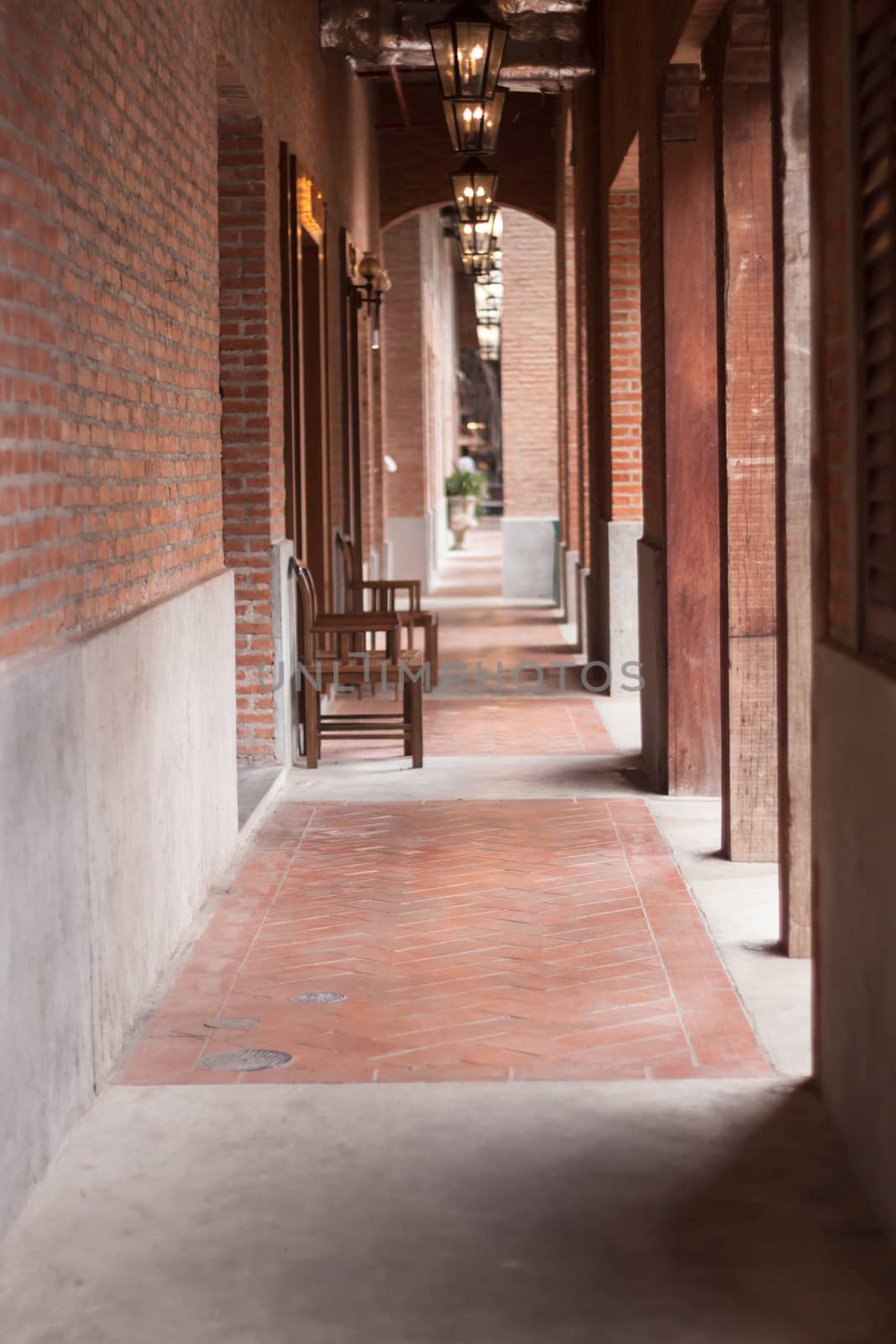 Walkway along the red brick wall, stock photo