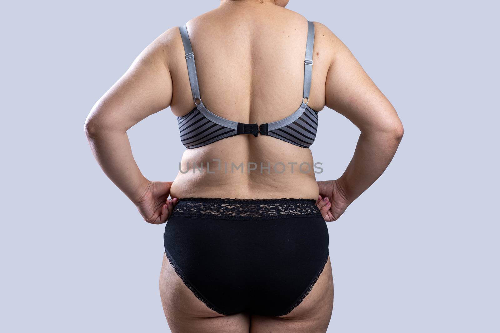 Woman Real Body Plus size Model in lingerie posign, imperfect nonideal