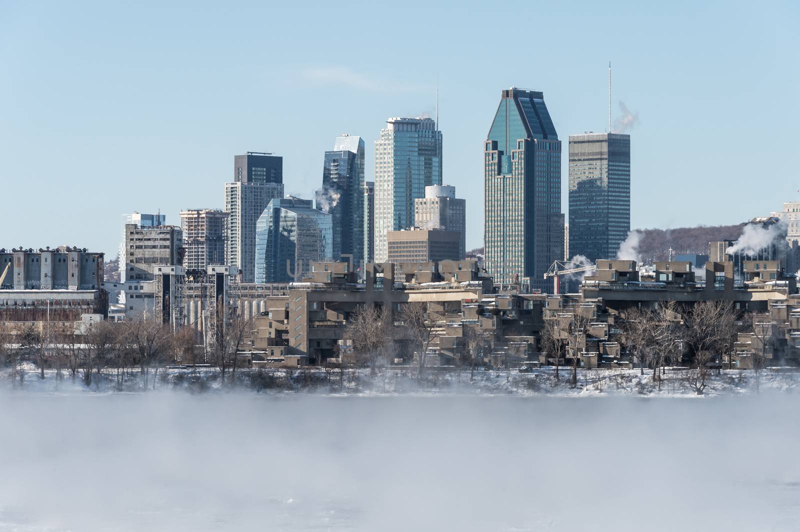 Montreal Skyline in winter as ice fog rises off the St. Lawrence by mbruxelle