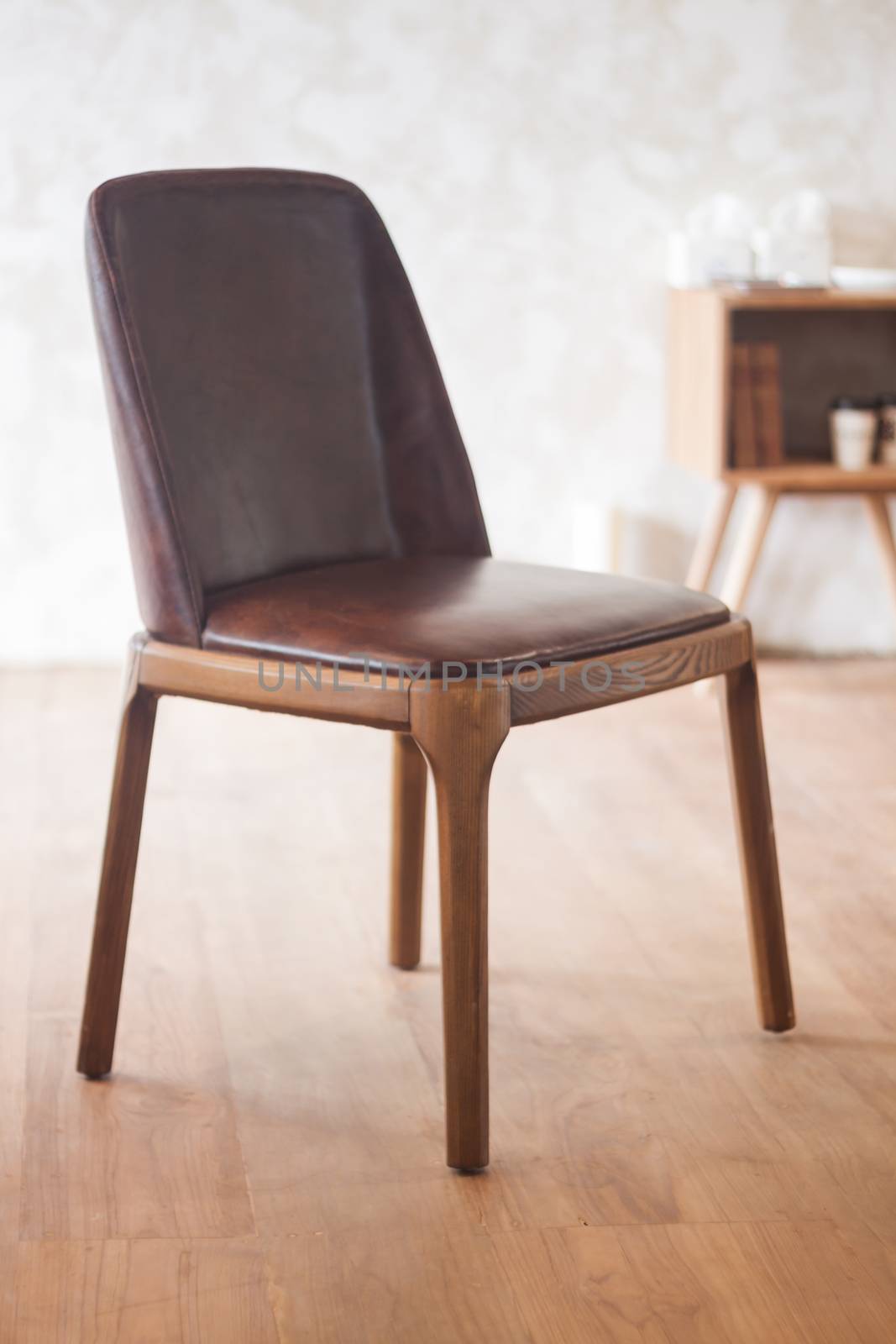 Brown classic chair decorated in coffee shop by punsayaporn