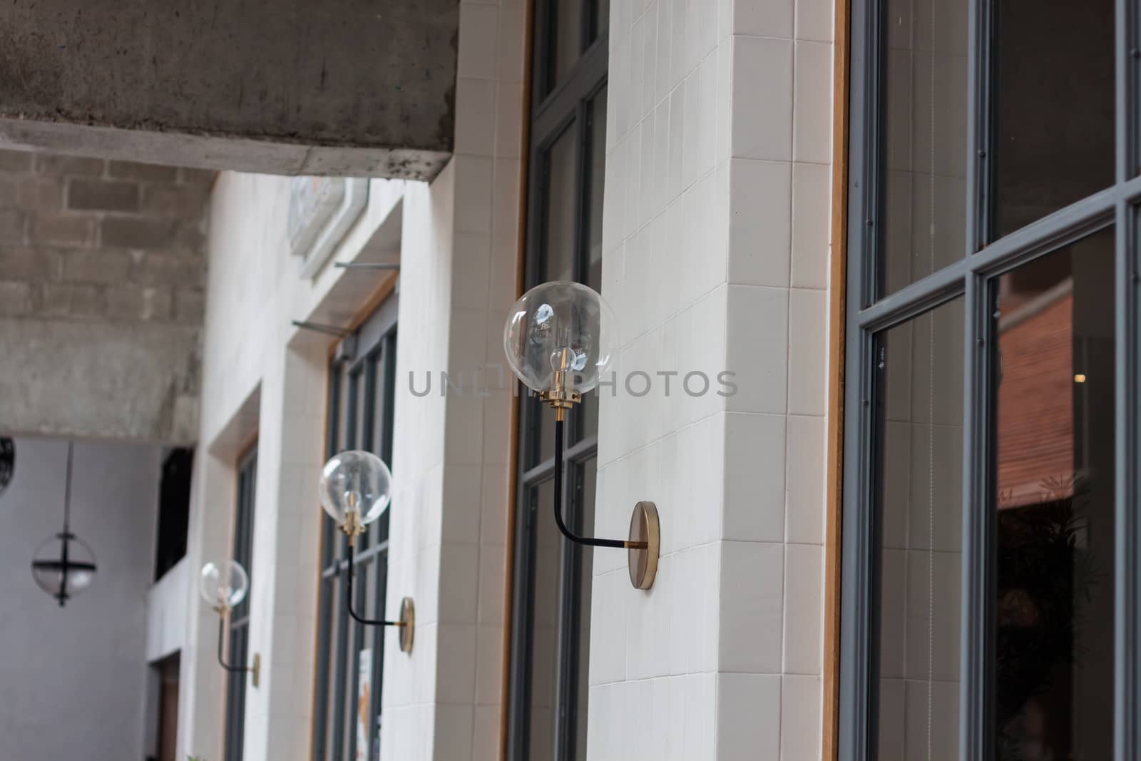 Metal lighting lamp on the wall by punsayaporn