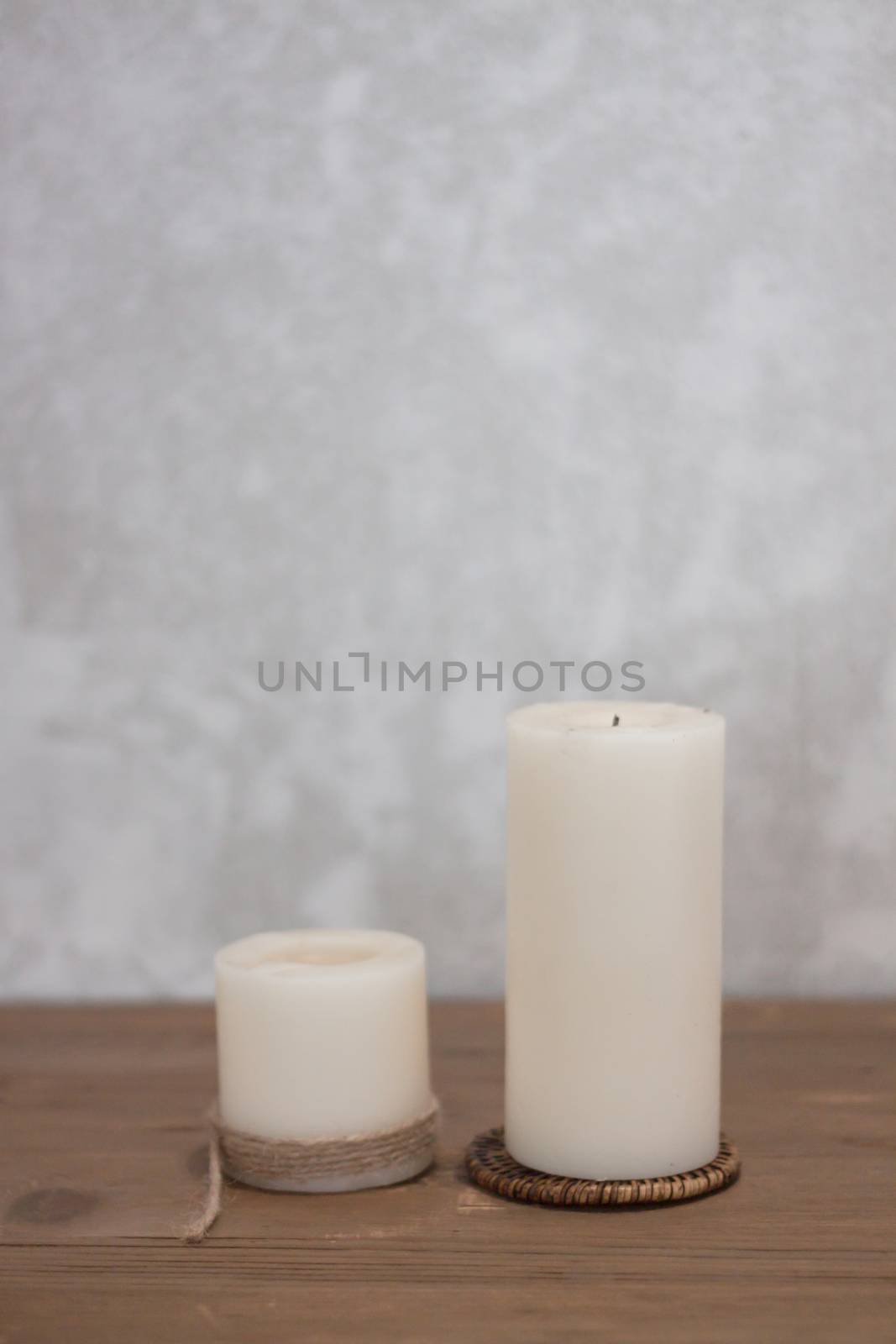 Two candles decorated in coffee shop by punsayaporn