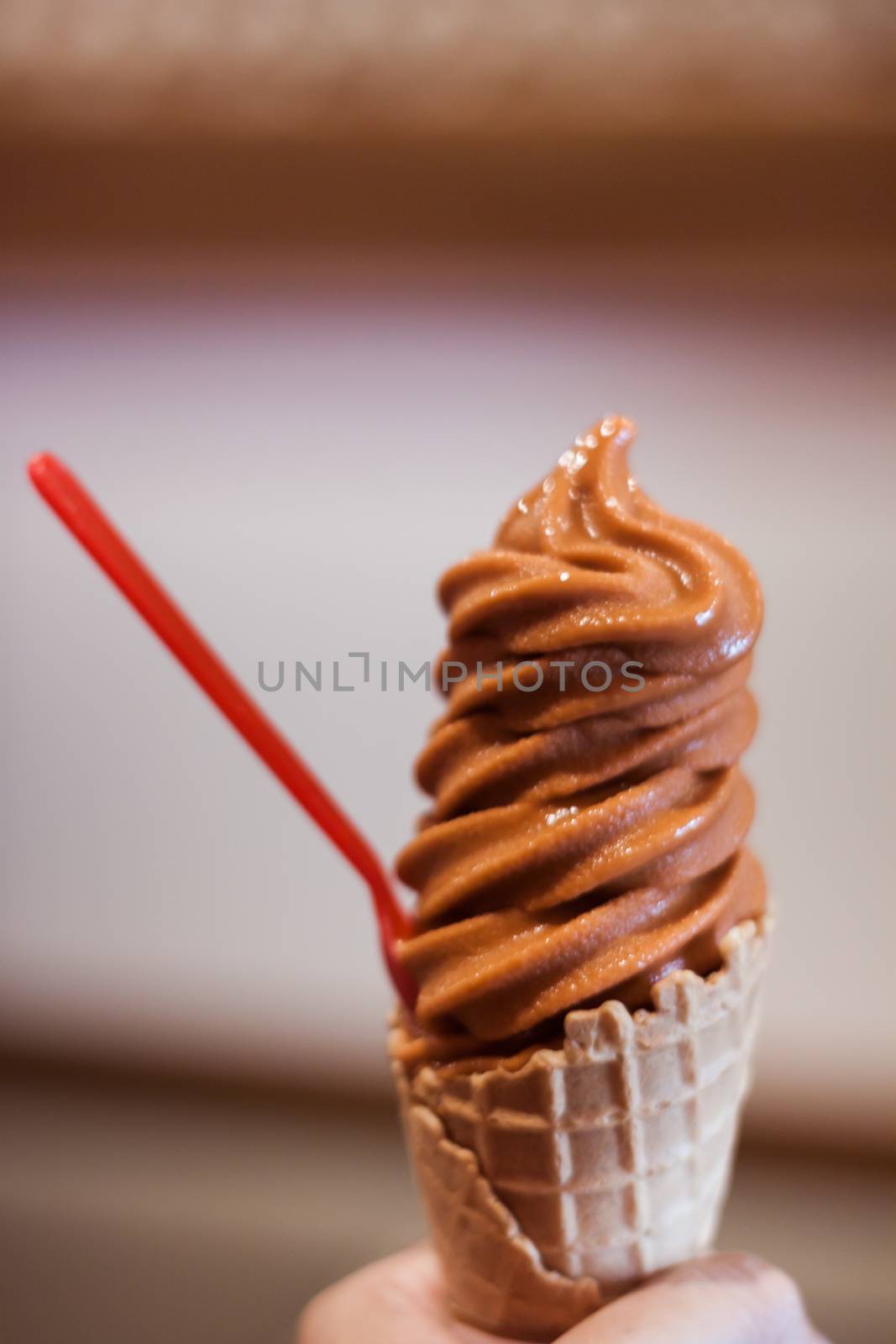 Ice cream cone on hand, stock photo