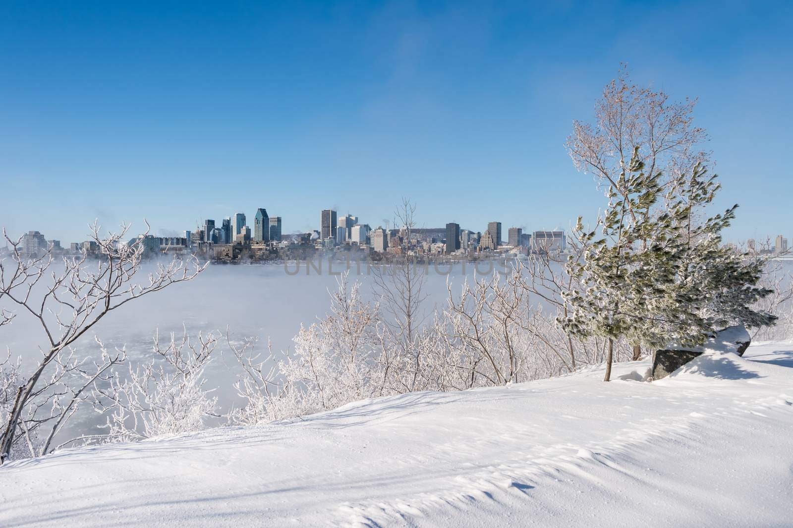 Montreal, CA - 1 January 2018: Montreal Skyline in winter as ice by mbruxelle