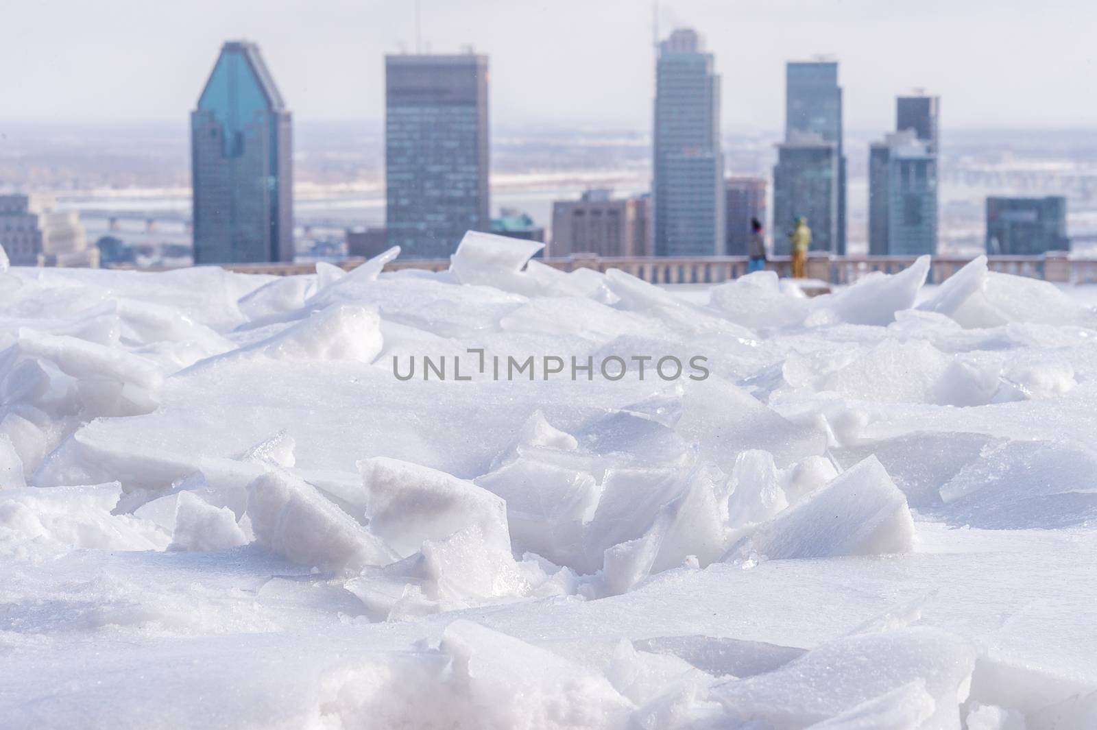 Broken ice after freezing rain and Montreal skyline in backgroun by mbruxelle