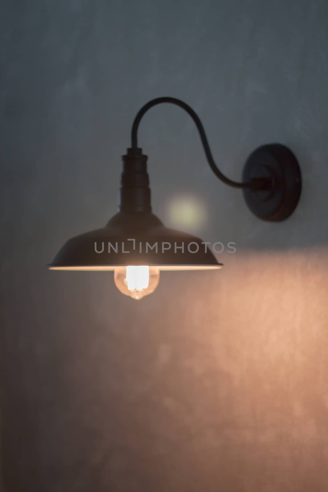 Metal lighting lamp on the wall by punsayaporn