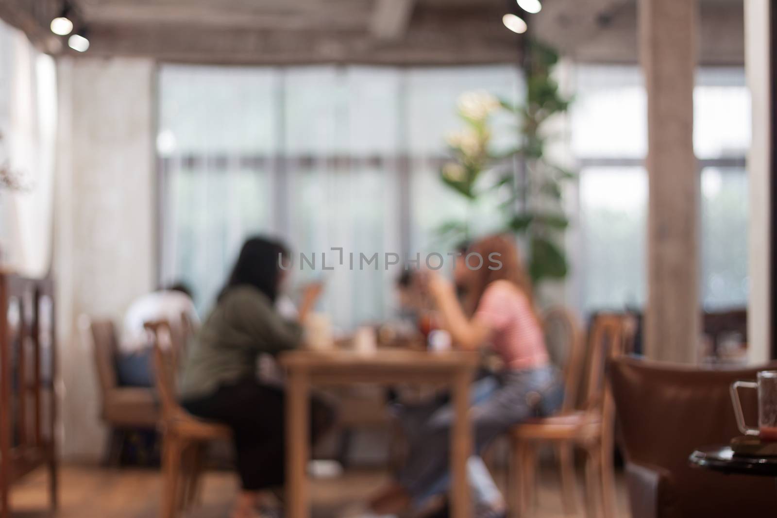 Blurred background of people in cafe by punsayaporn