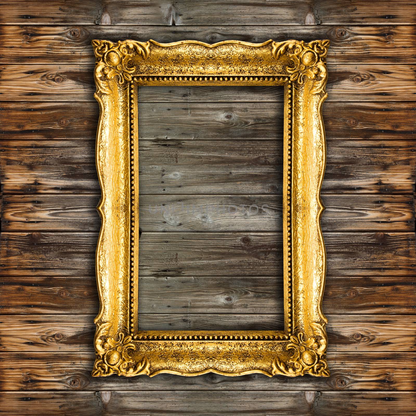 Old Gold Picture Frame on wooden background by adamr