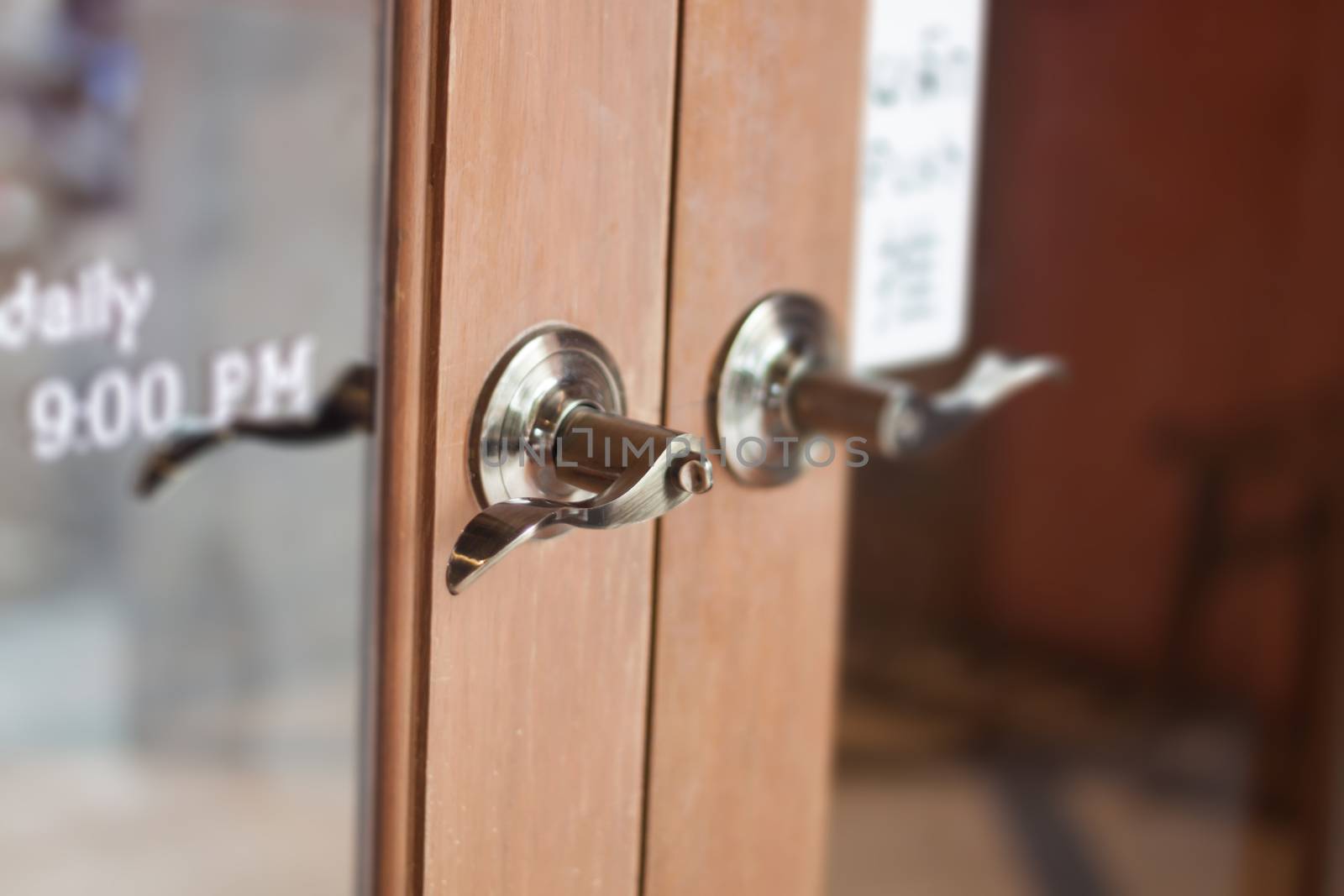 Metal door handles on wardrobe doors, stock photo