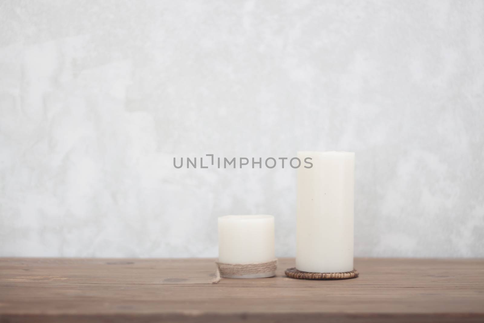 Two candles decorated in coffee shop by punsayaporn