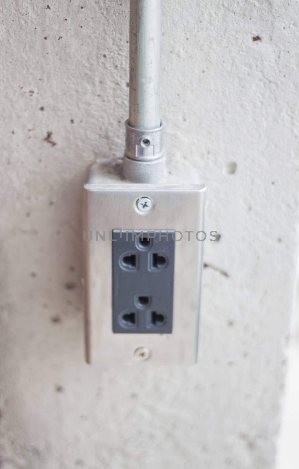 Power socket on concrete wall by punsayaporn