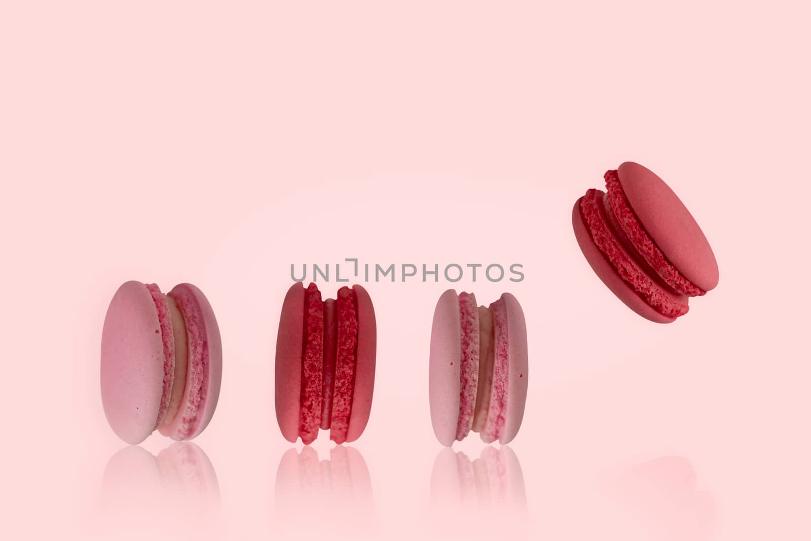 colorful macaroons on the pink background by feelartfeelant