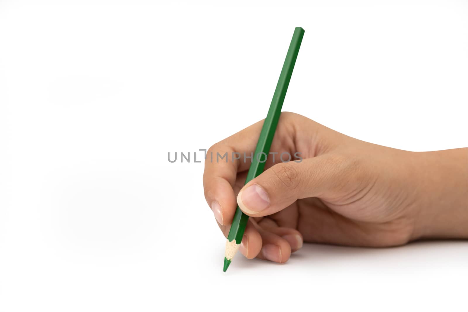 Female hand with green color pencil isolated on white background.