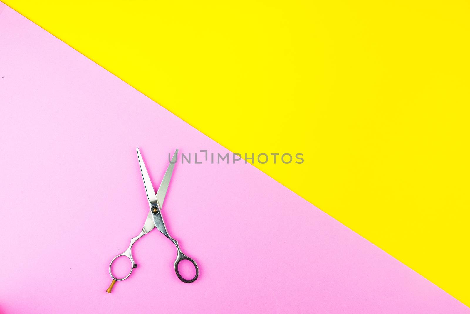 Stylish Professional Barber Scissors on yellow and pink backgrou by Bubbers