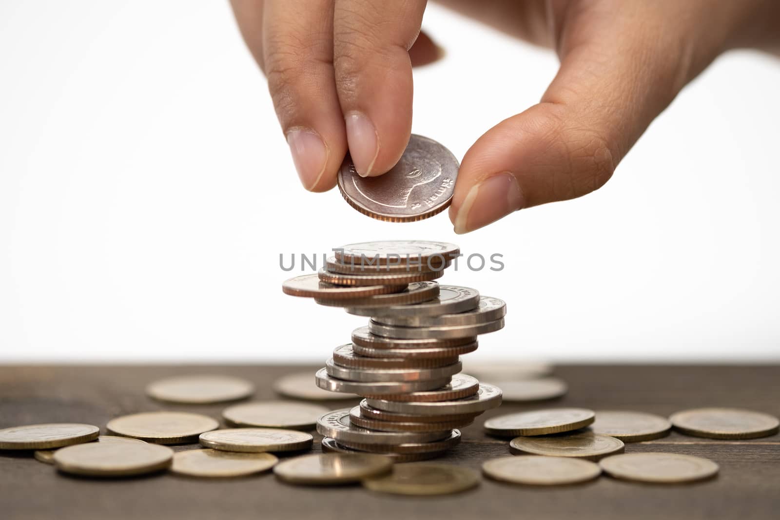 Hand stack coins,  concept for Saving money, growing business an by feelartfeelant