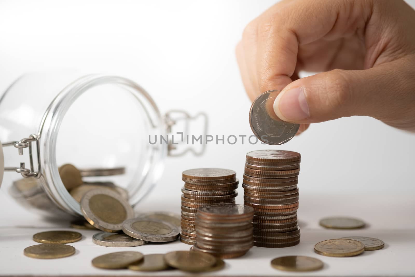 Hand stack coins,  concept for Saving money, growing business an by feelartfeelant