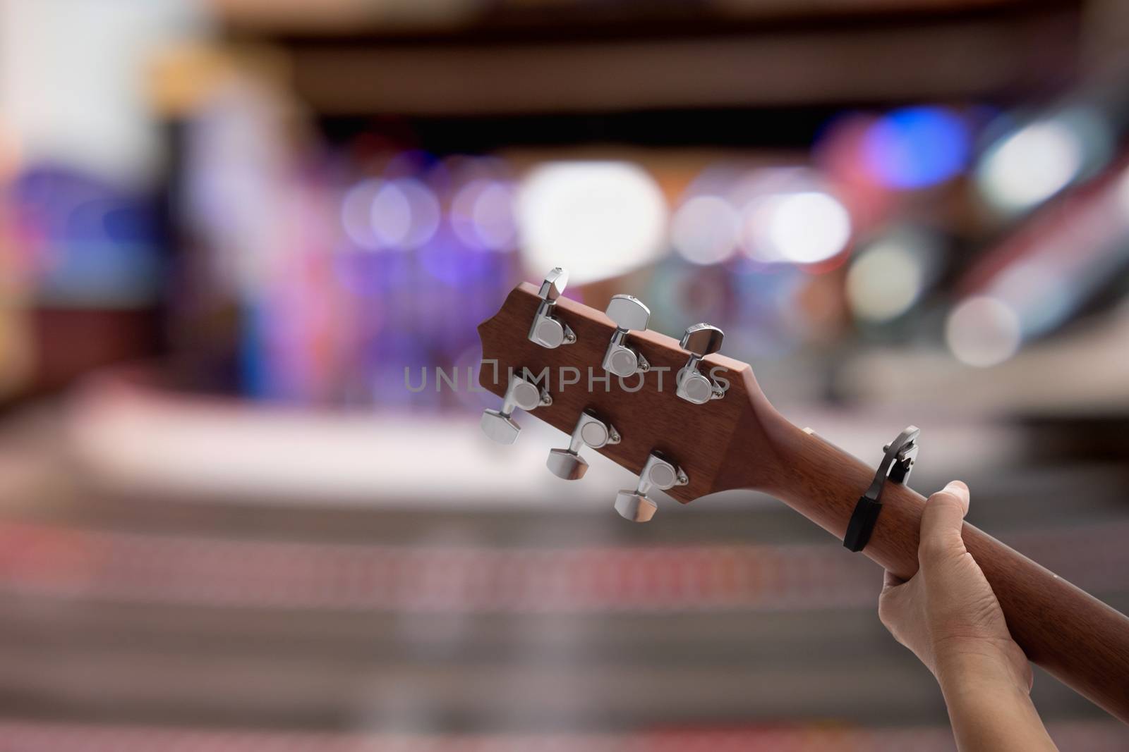 Close up woman's hands playing acoustic guitar. by feelartfeelant