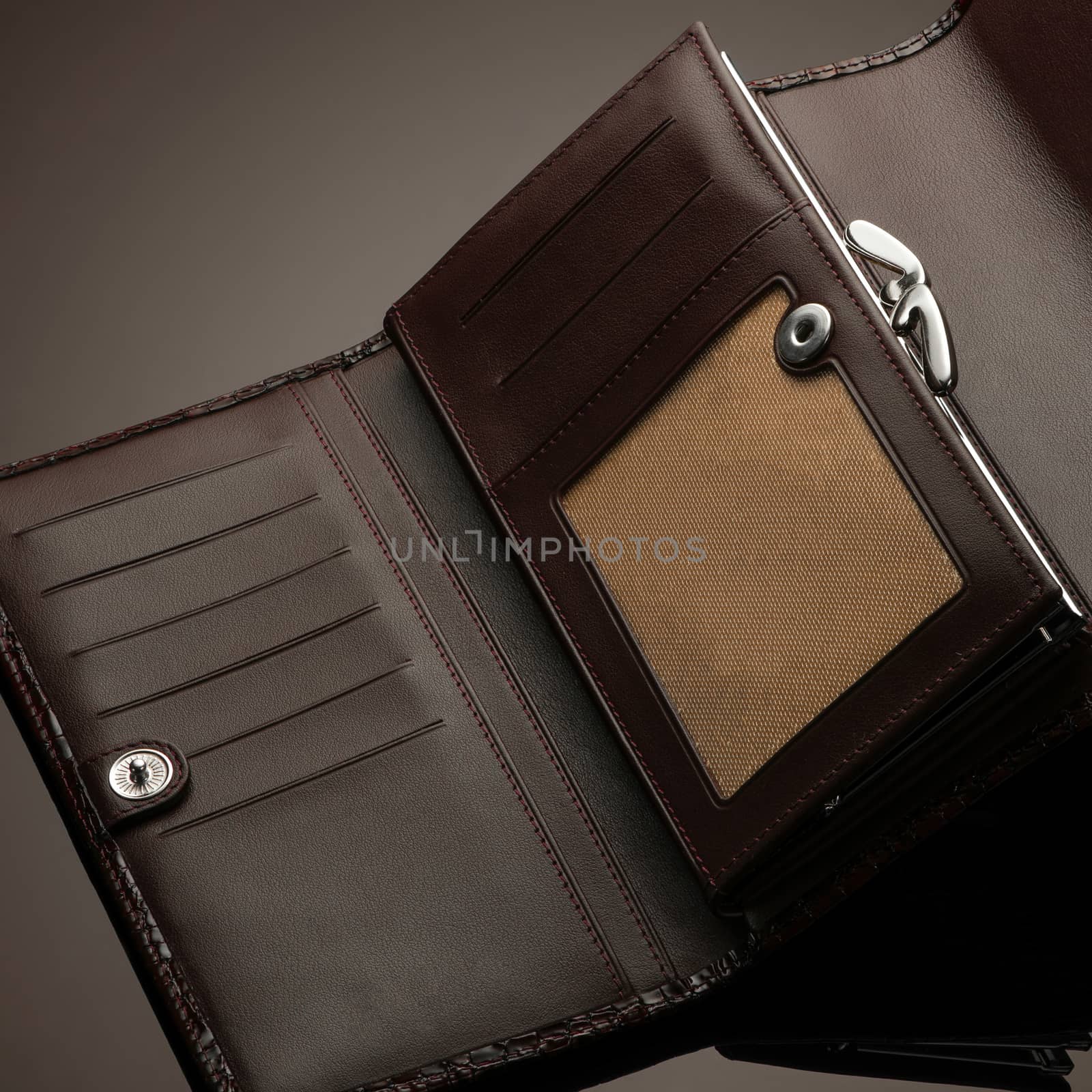 Fashionable leather men's wallet on a dark background