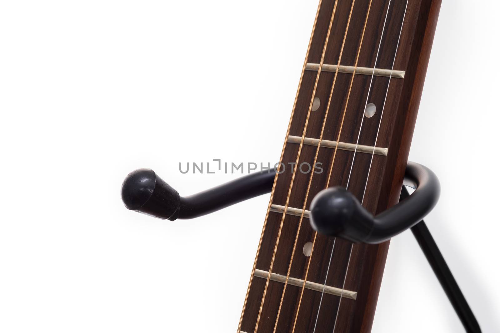 Guitar is a classic instrument on stand.