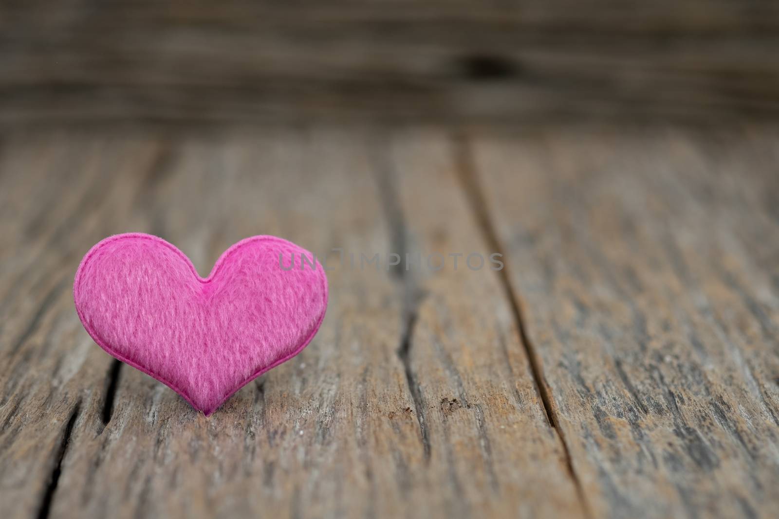 Image-One Heart on wooden background. Copy space Valentines day concept.