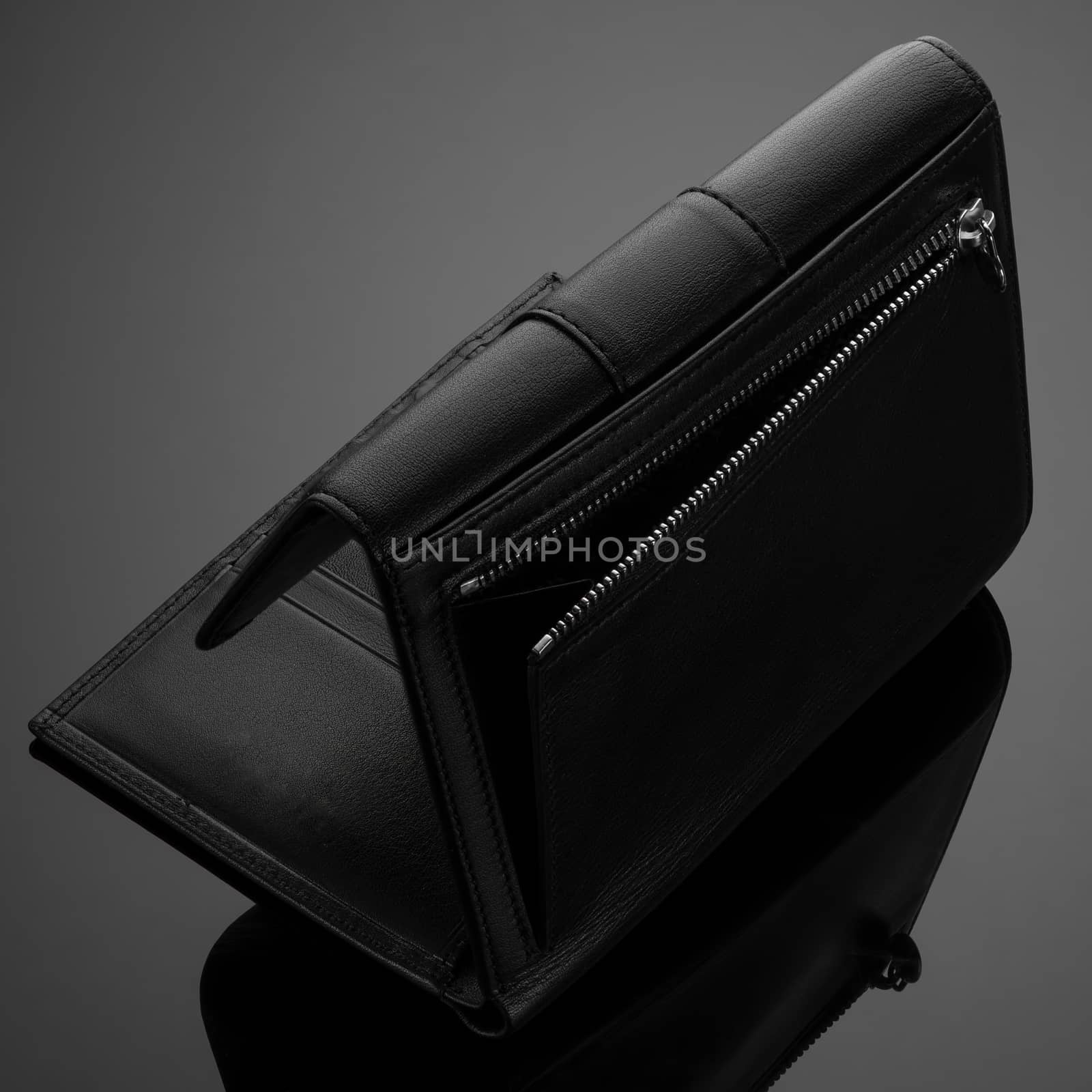 men's wallet on a black background by A_Karim