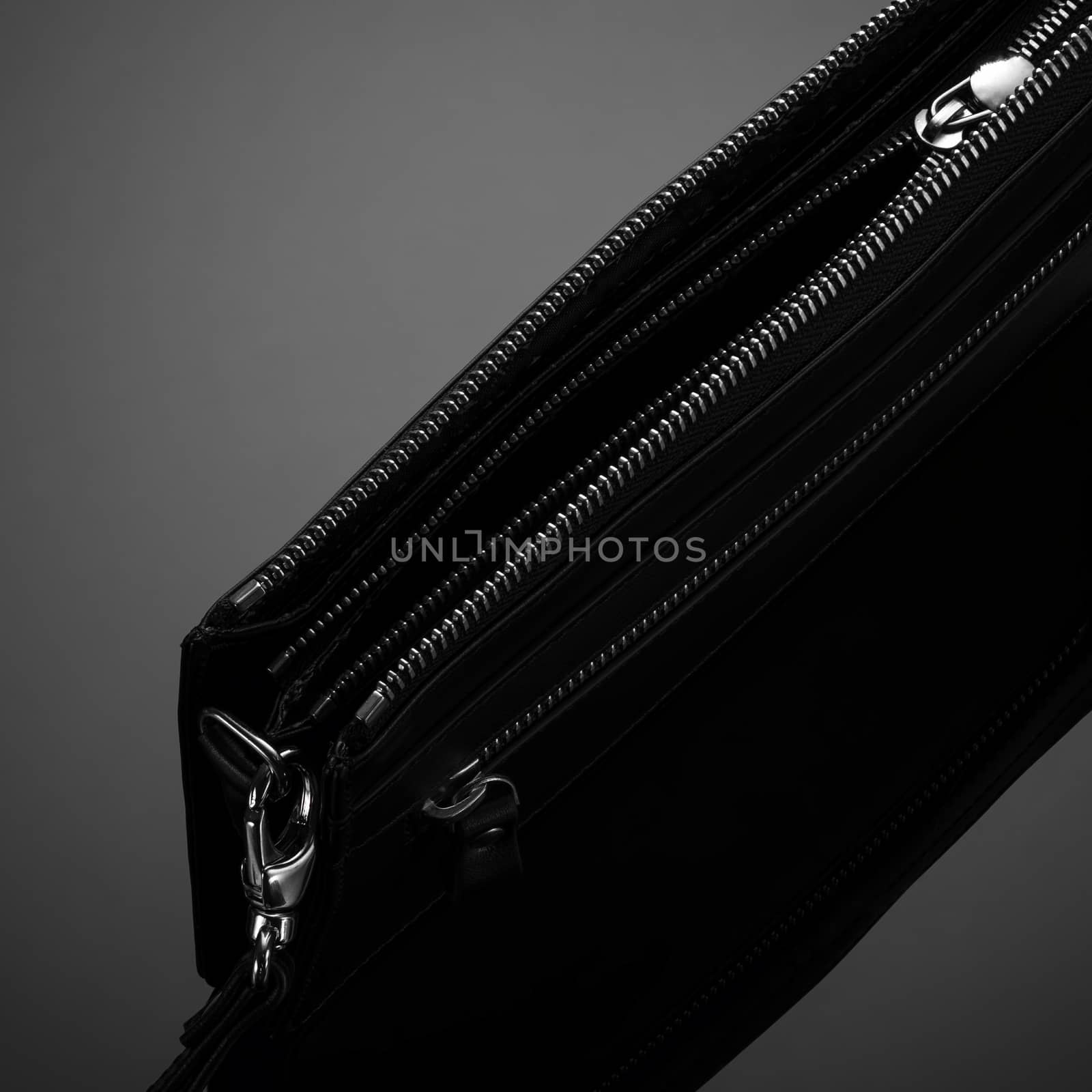 Fashionable leather men's wallet on a dark background