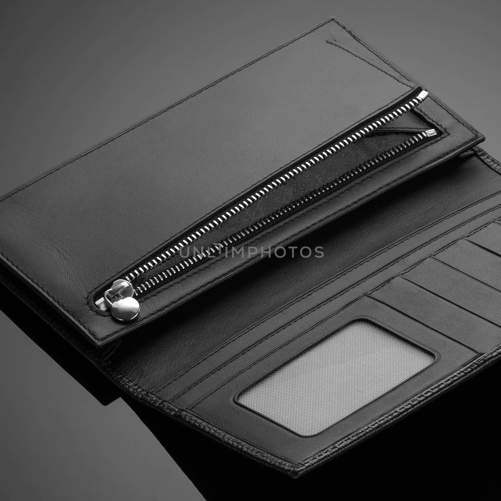 Fashionable leather men's wallet on a dark background