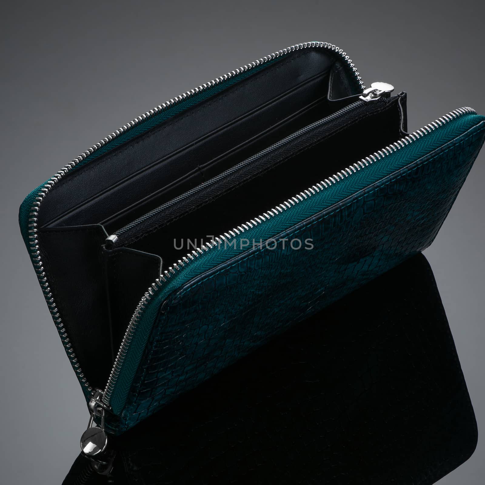 Fashionable designer leather women's wallet on a dark background