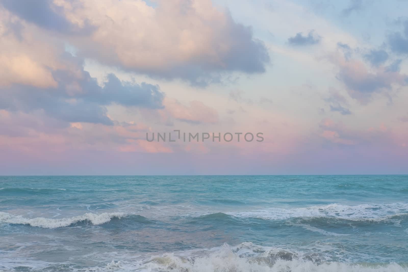 Beautiful pastel sunset sky with cloudscape over the Songkhla ocean.