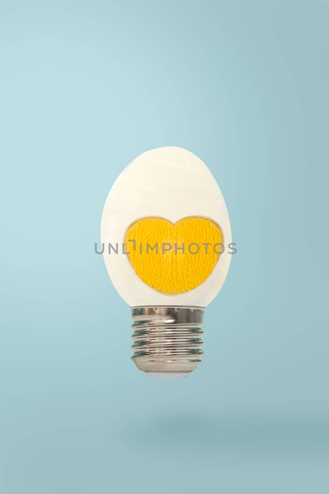 Half boiled egg with lamon blue p botton background, minimal style.