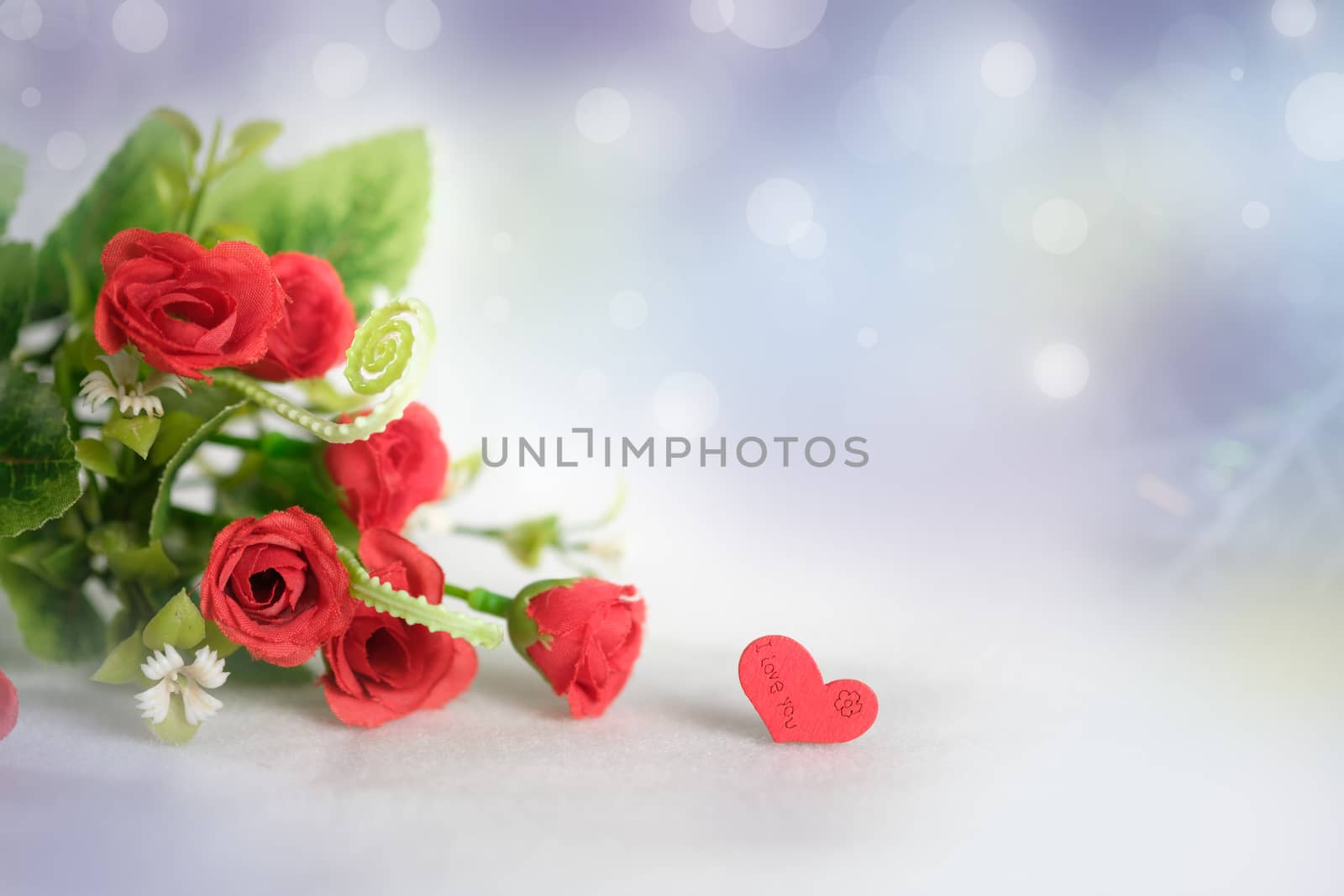 The red rose on abstract bokeh background in love concept for valentines day with romantic moment.