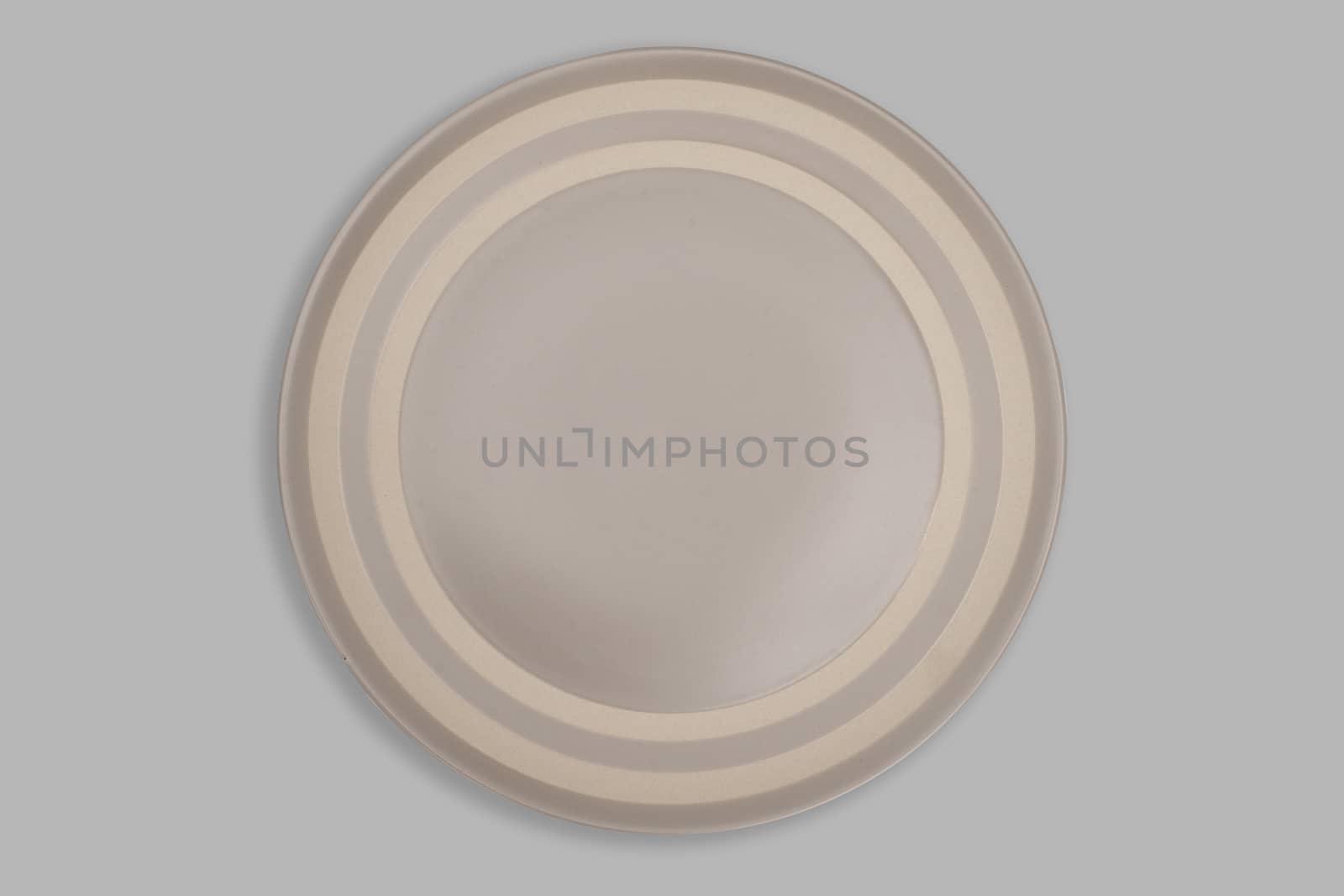Top view-Empty brown ceeamic round dish plate isolated on grey background.