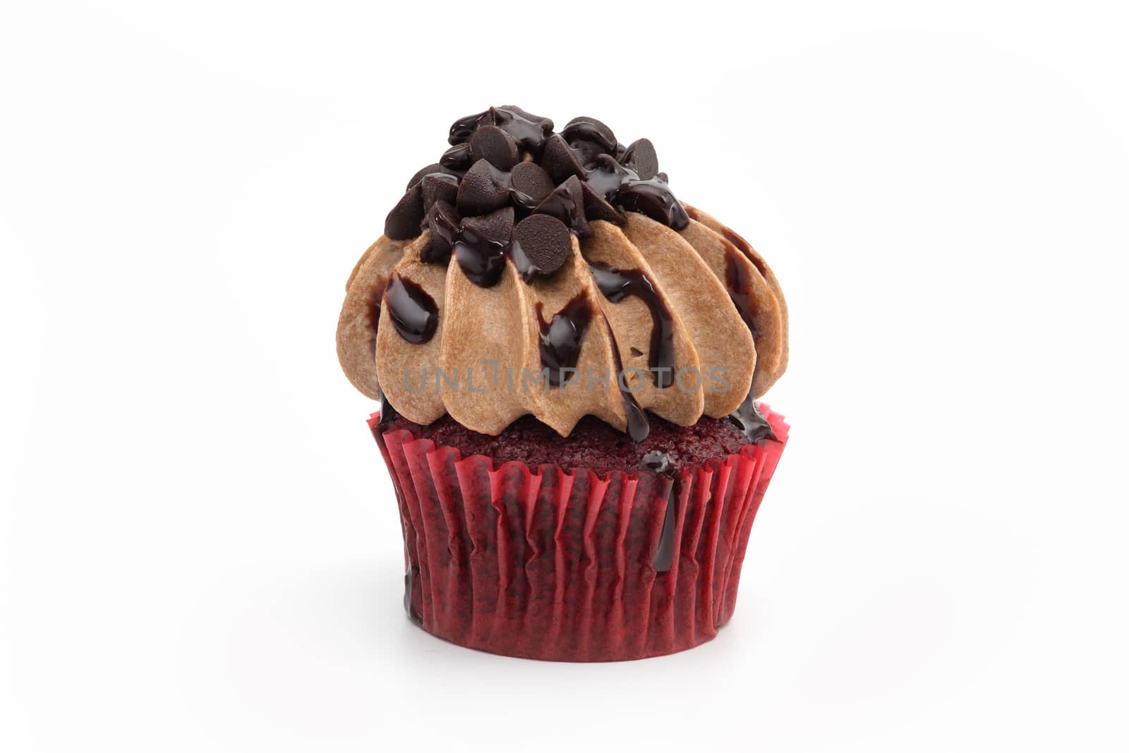 Chocolate cupcake with sprinkles isolated on white background.